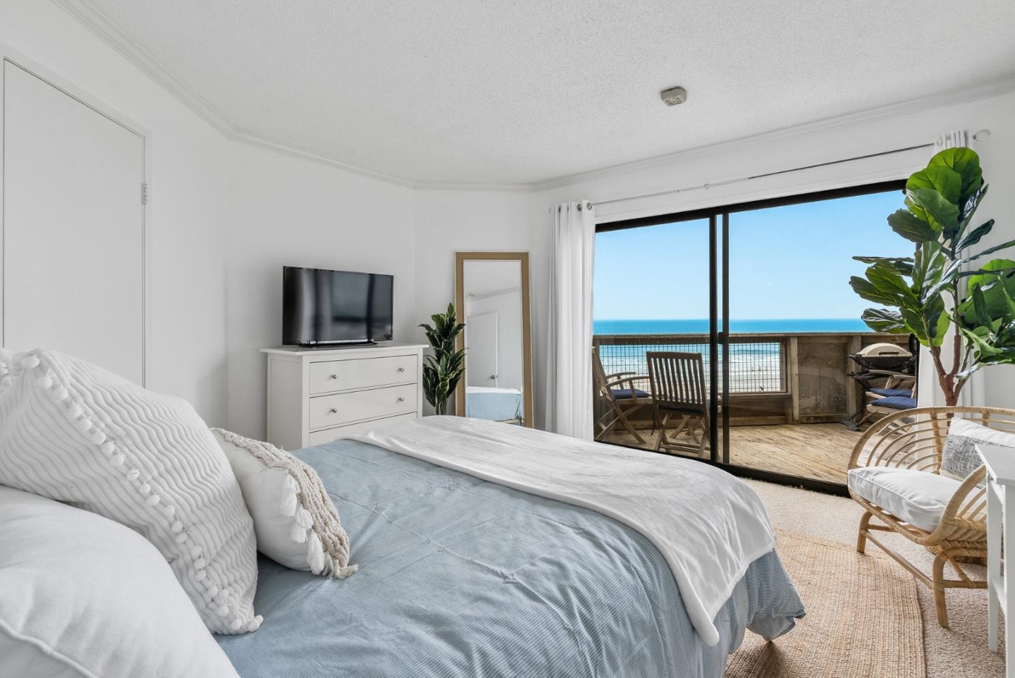 101 Shell Road, Unit 32 Watsonville, CA 95076 - Photo 26 of 44 a bedroom with a bed and a flat screen television