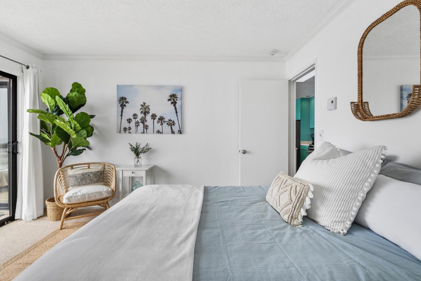 101 Shell Road, Unit 32 Watsonville, CA 95076 - Photo 29 of 44 a bedroom with a bed and a potted plant