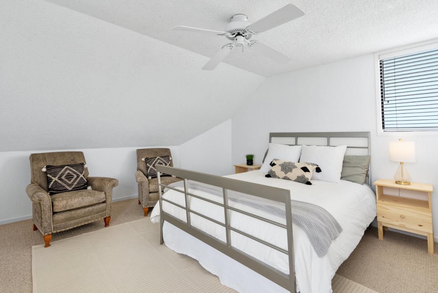 101 Shell Road, Unit 32 Watsonville, CA 95076 - Photo 34 of 44 a bedroom with a bed and a couch