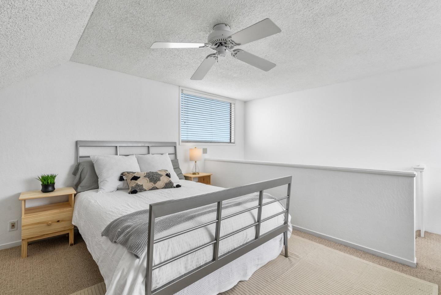 101 Shell Road, Unit 32 Watsonville, CA 95076 - Photo 35 of 44 a bedroom with a bed and a ceiling fan