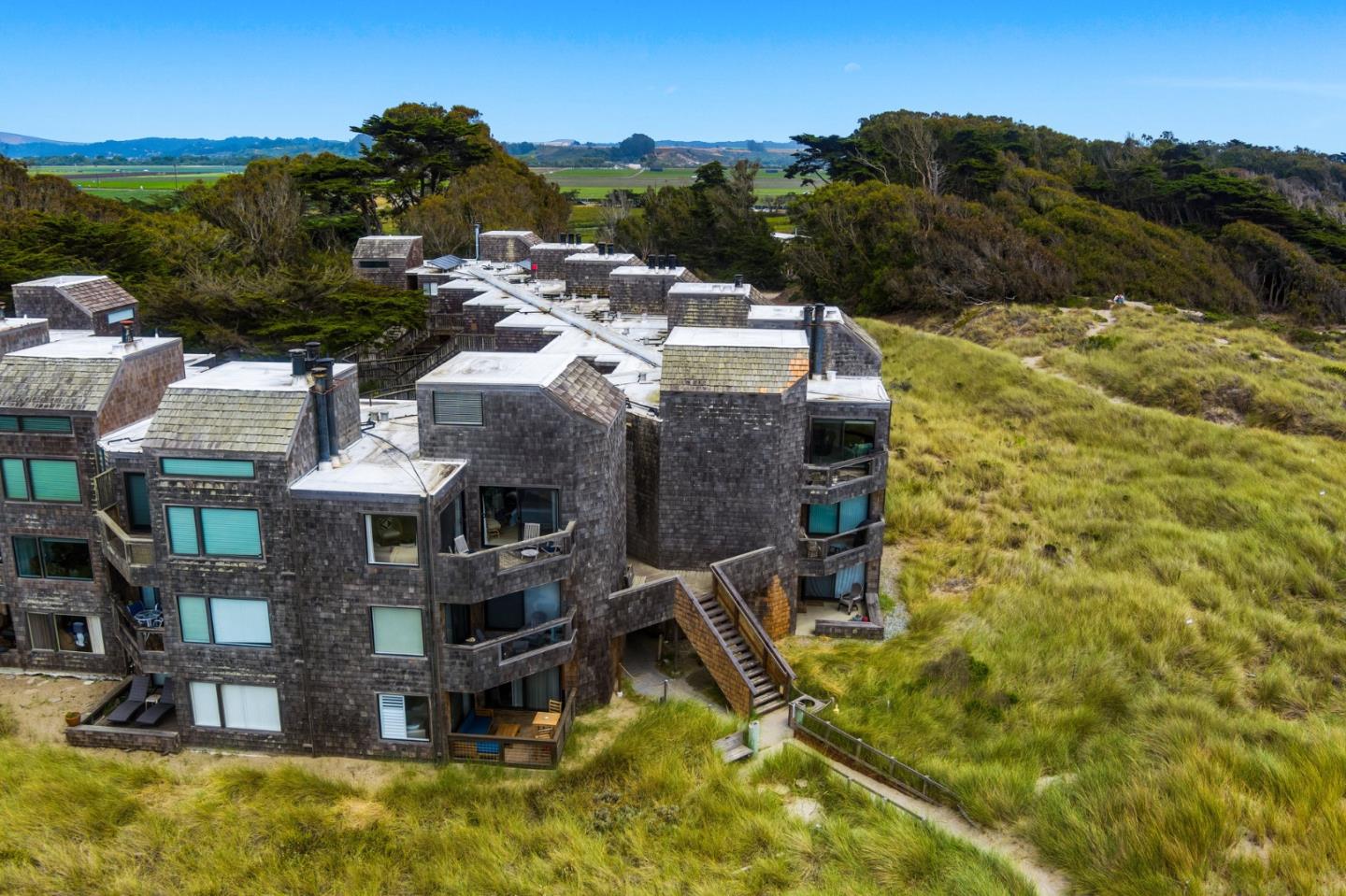 101 Shell Road, Unit 32 Watsonville, CA 95076 - Photo 43 of 44 an aerial view of residential houses with outdoor space and trees