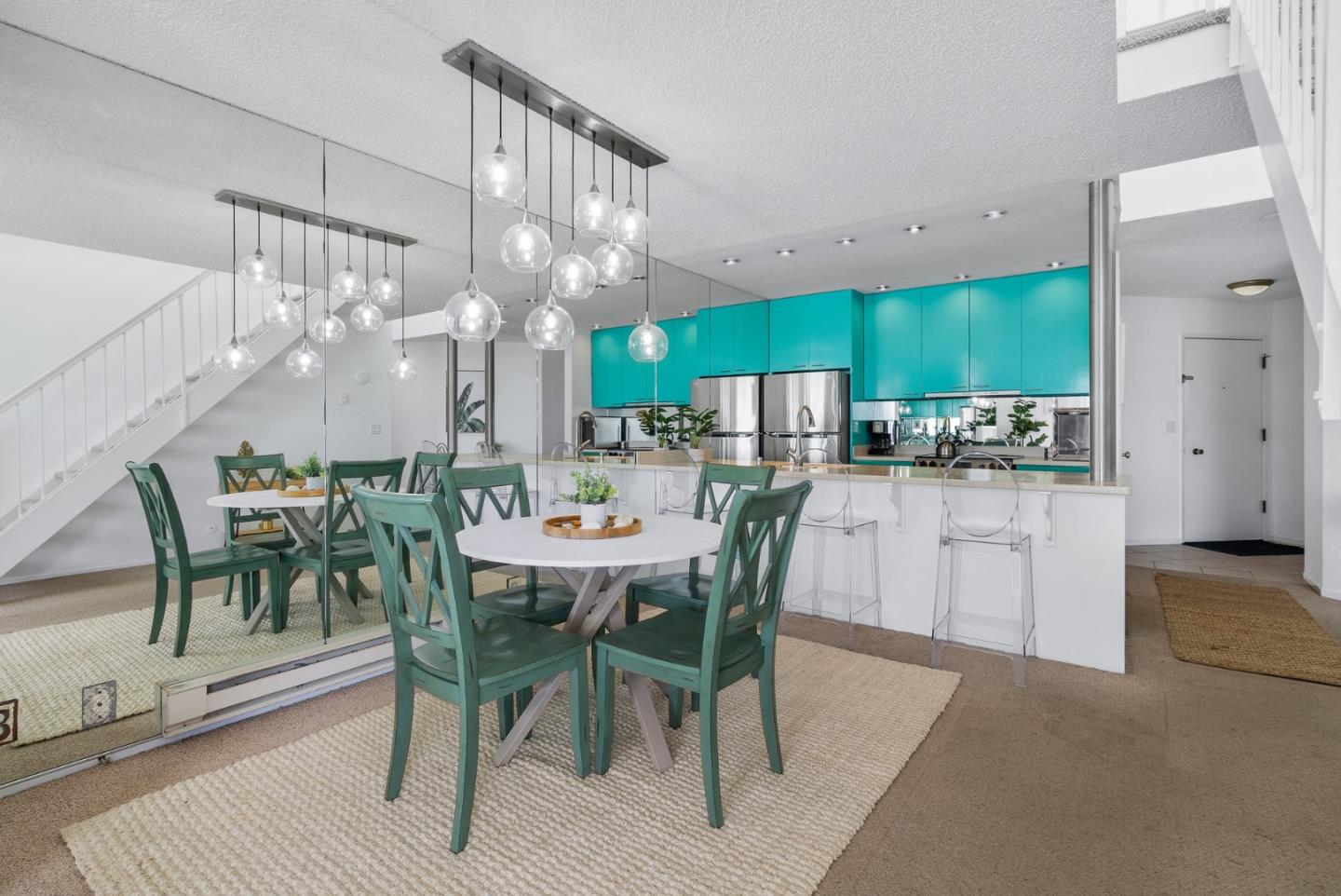 101 Shell Road, Unit 32 Watsonville, CA 95076 - Photo 10 of 44 a view of a dining room and livingroom with furniture a kitchen and chandelier