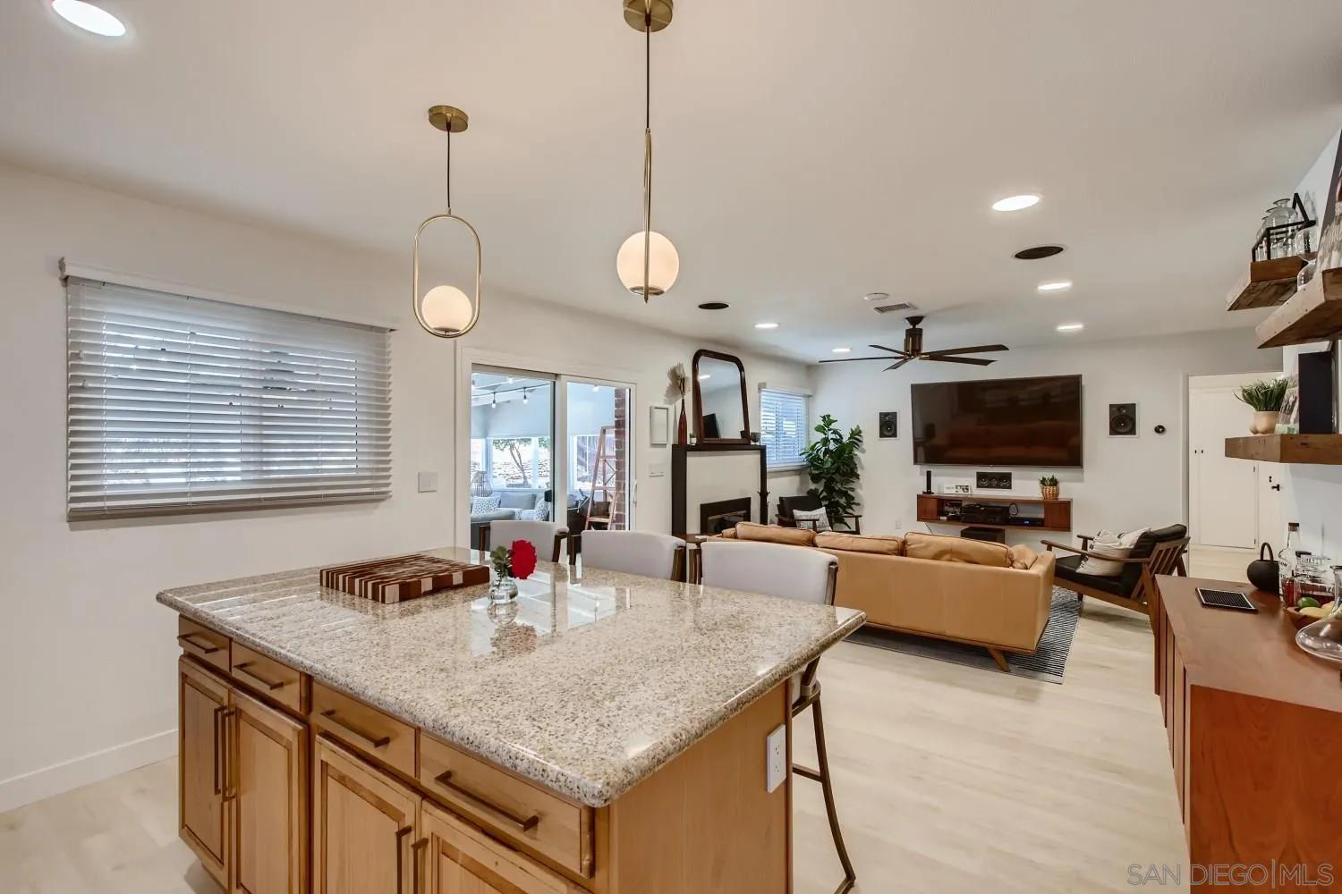 14167 Frame Road Poway, CA 92064 - Photo 11 of 27 a kitchen with sink refrigerator and couches