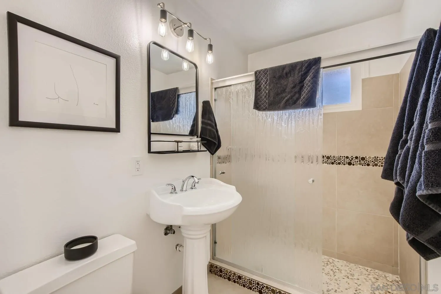 14167 Frame Road Poway, CA 92064 - Photo 14 of 27 a bathroom with a sink and a mirror