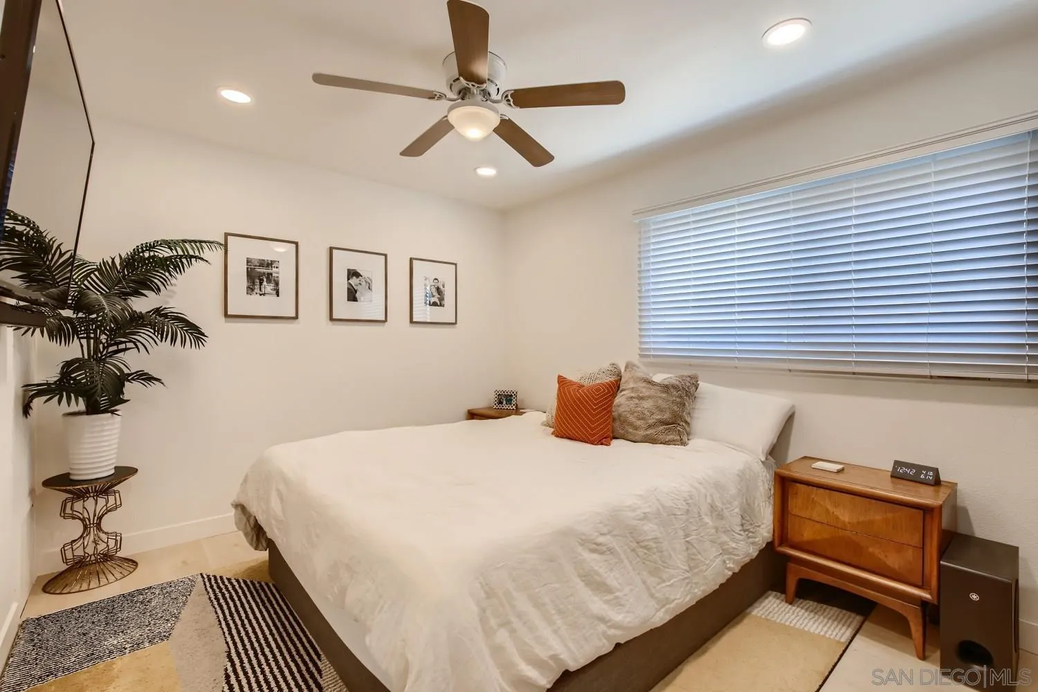 14167 Frame Road Poway, CA 92064 - Photo 17 of 27 a bedroom with a bed and a chandelier