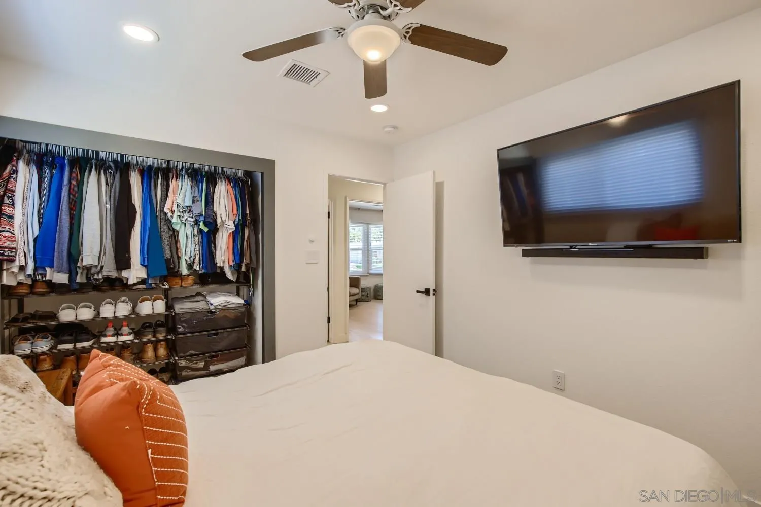 14167 Frame Road Poway, CA 92064 - Photo 18 of 27 a bedroom with a bed and a flat screen tv