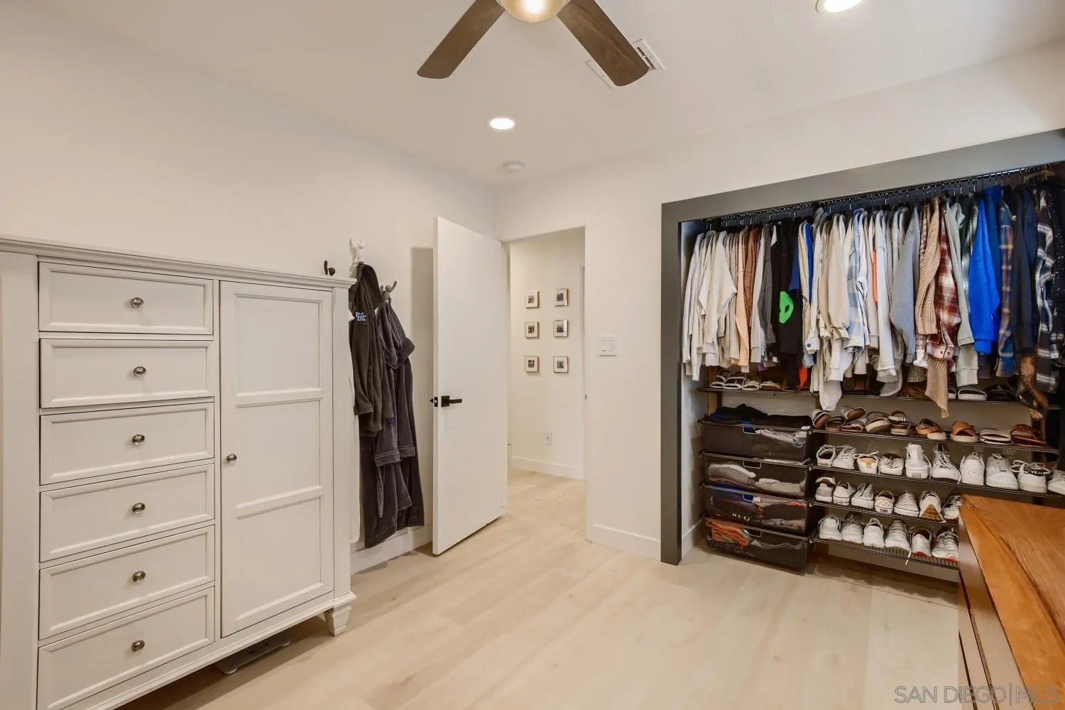 14167 Frame Road Poway, CA 92064 - Photo 20 of 27 walk in closet with window and hardwood floor