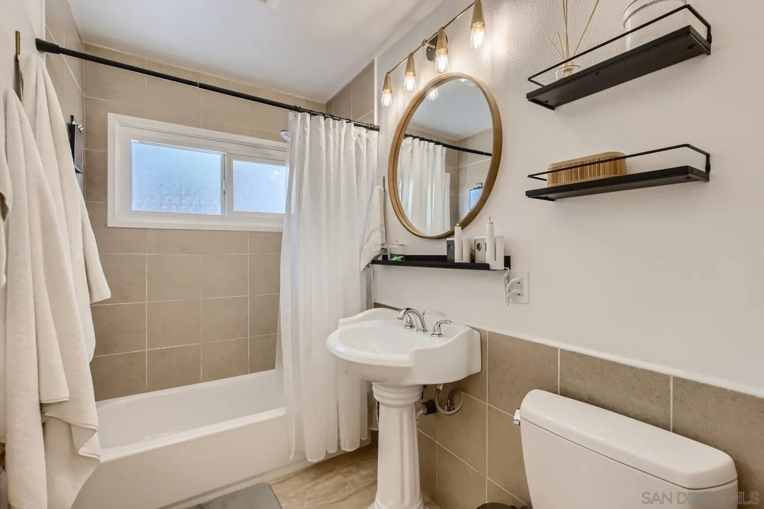 14167 Frame Road Poway, CA 92064 - Photo 21 of 27 a bathroom with a sink a toilet and a mirror
