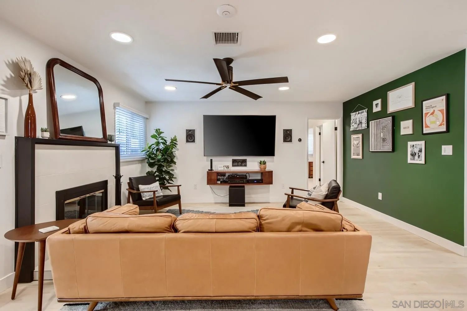 14167 Frame Road Poway, CA 92064 - Photo 7 of 27 a living room with furniture a fireplace and a flat screen tv