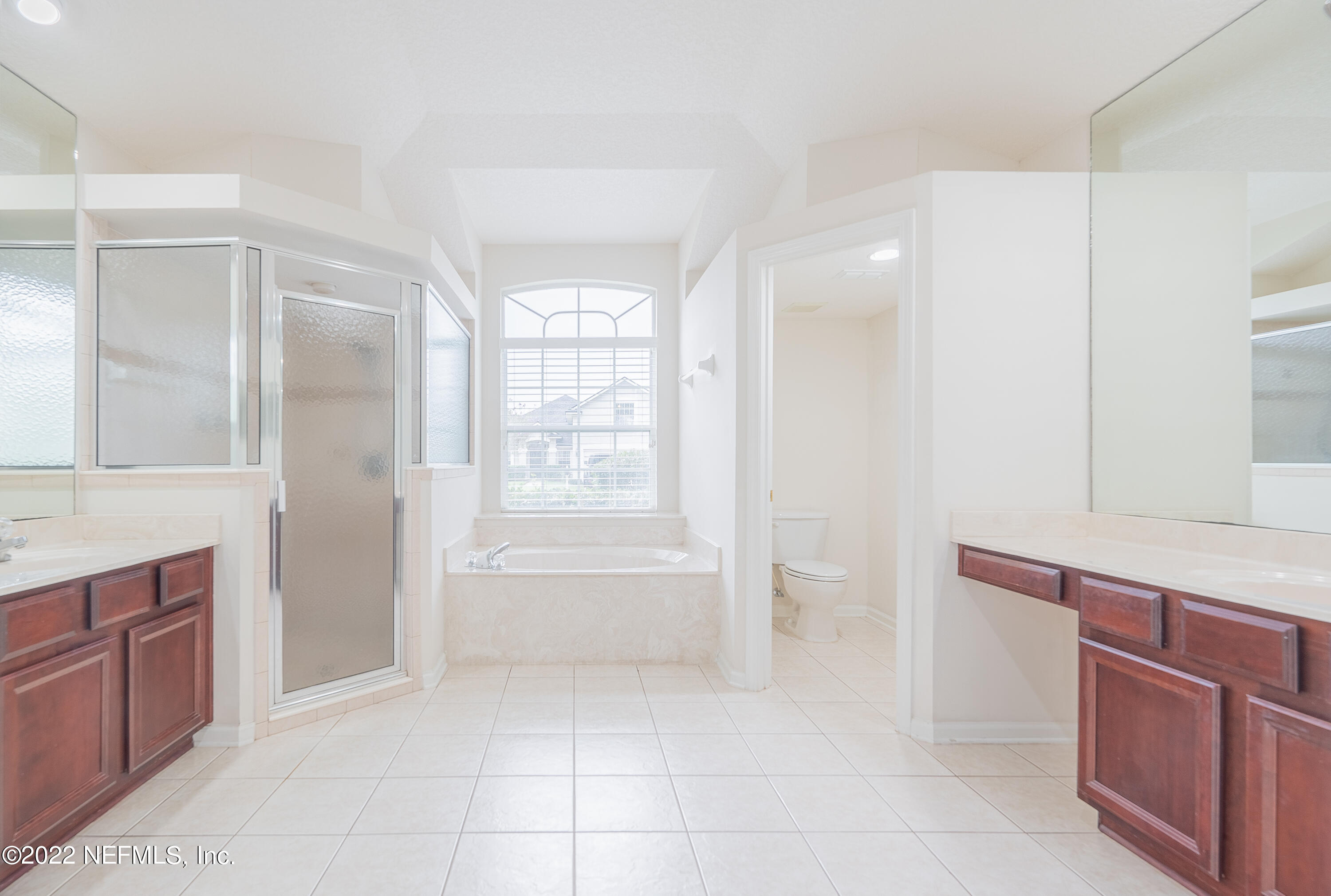 1535 Summerdown Way St. Johns, FL 32259 - Photo 11 of 38 a bathroom with a bathtub sink and mirror