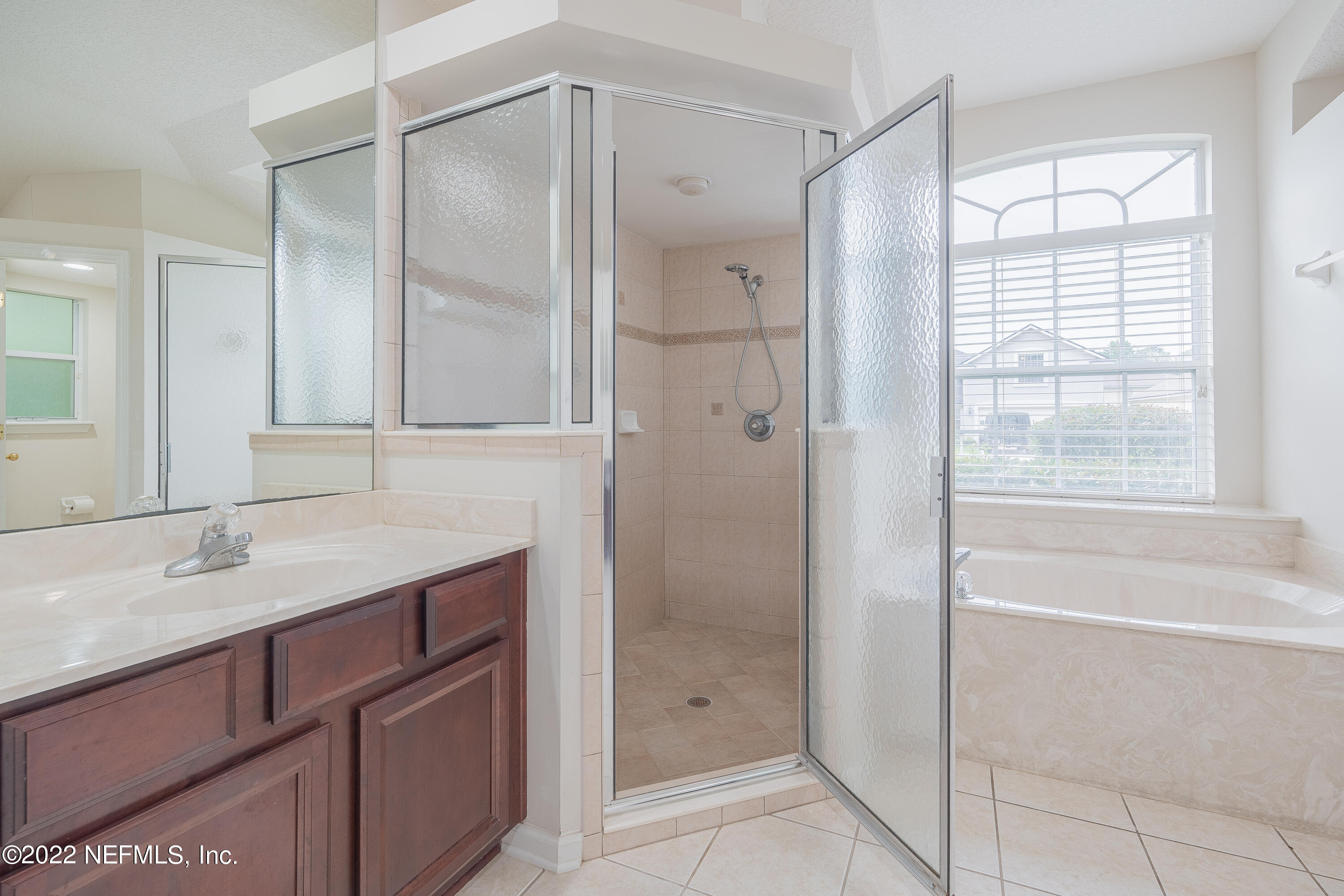 1535 Summerdown Way St. Johns, FL 32259 - Photo 13 of 38 a bathroom with a shower sink and vanity
