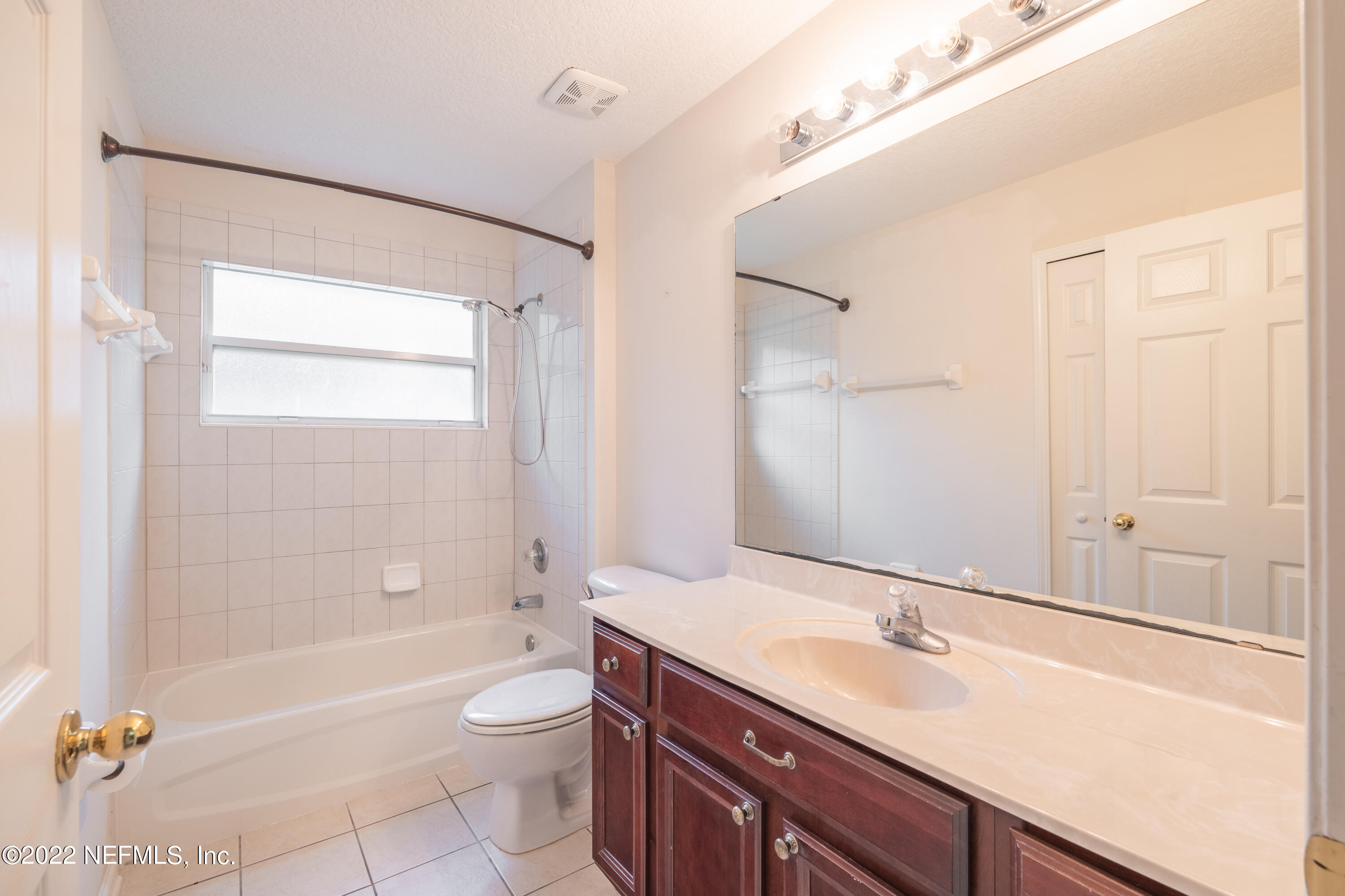 1535 Summerdown Way St. Johns, FL 32259 - Photo 18 of 38 a bathroom with a granite countertop sink a toilet and shower