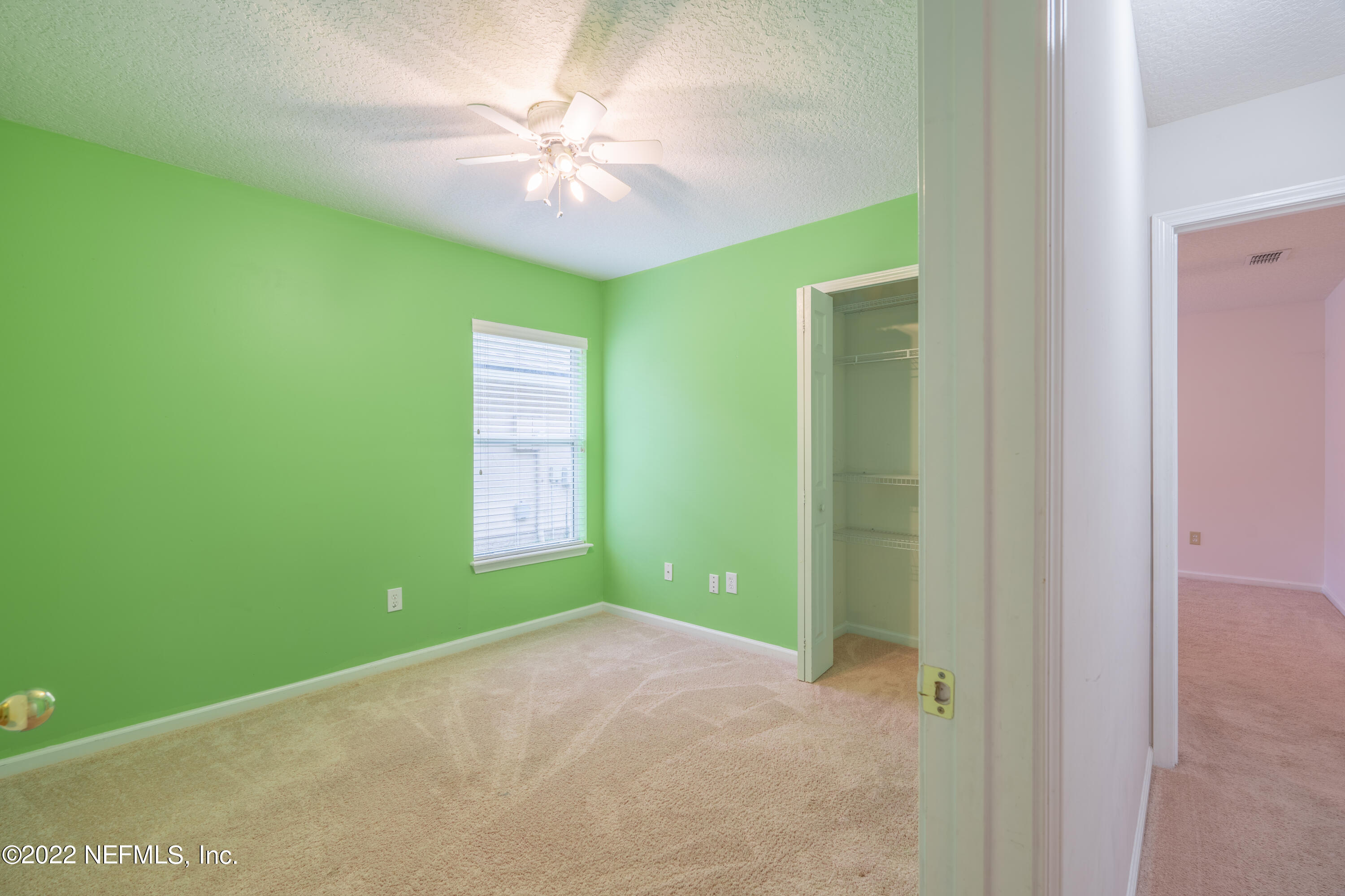 1535 Summerdown Way St. Johns, FL 32259 - Photo 21 of 38 a view of a big room with windows and chandelier fan