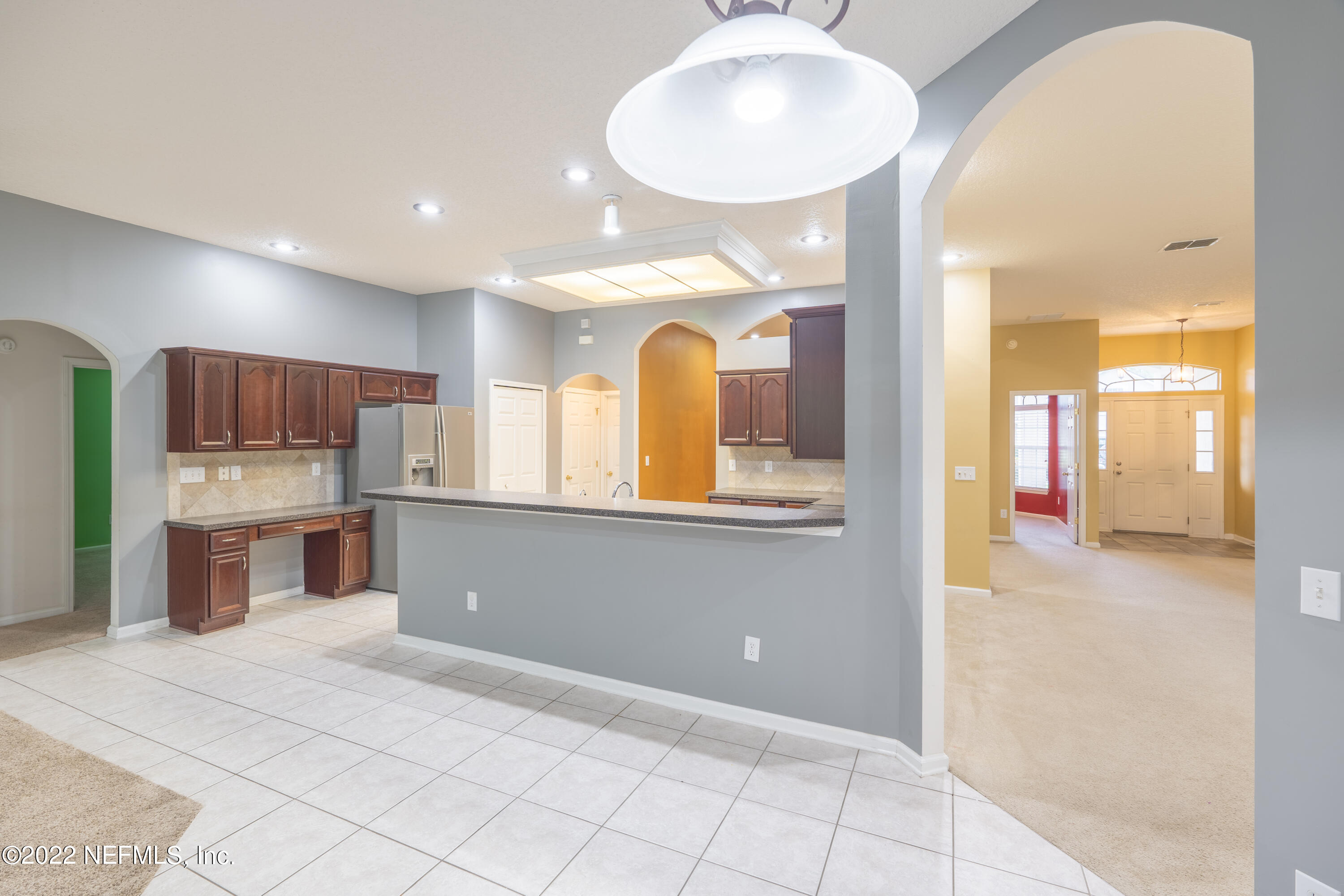 1535 Summerdown Way St. Johns, FL 32259 - Photo 26 of 38 a kitchen with stainless steel appliances granite countertop a stove a sink and a refrigerator