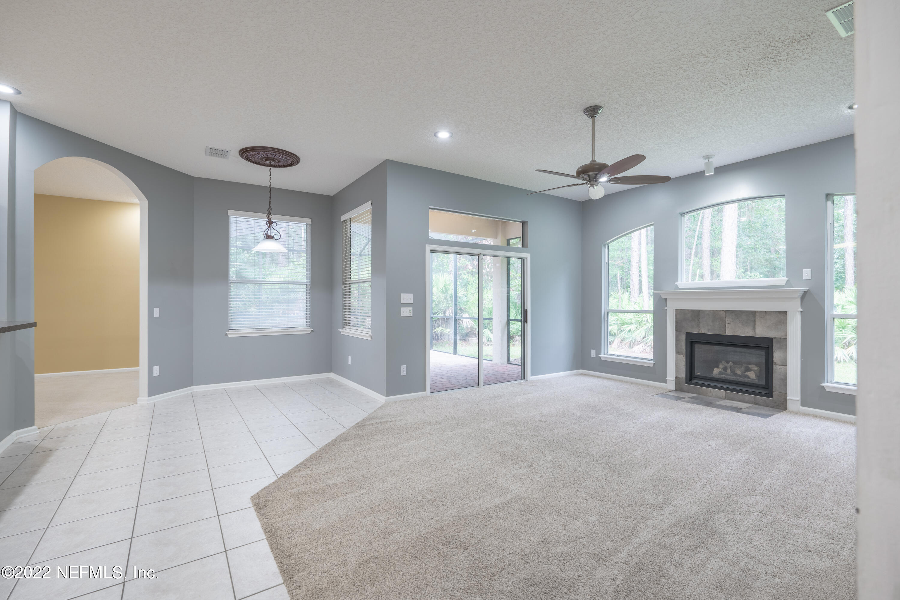 1535 Summerdown Way St. Johns, FL 32259 - Photo 29 of 38 a view of an empty room with a fireplace and a window
