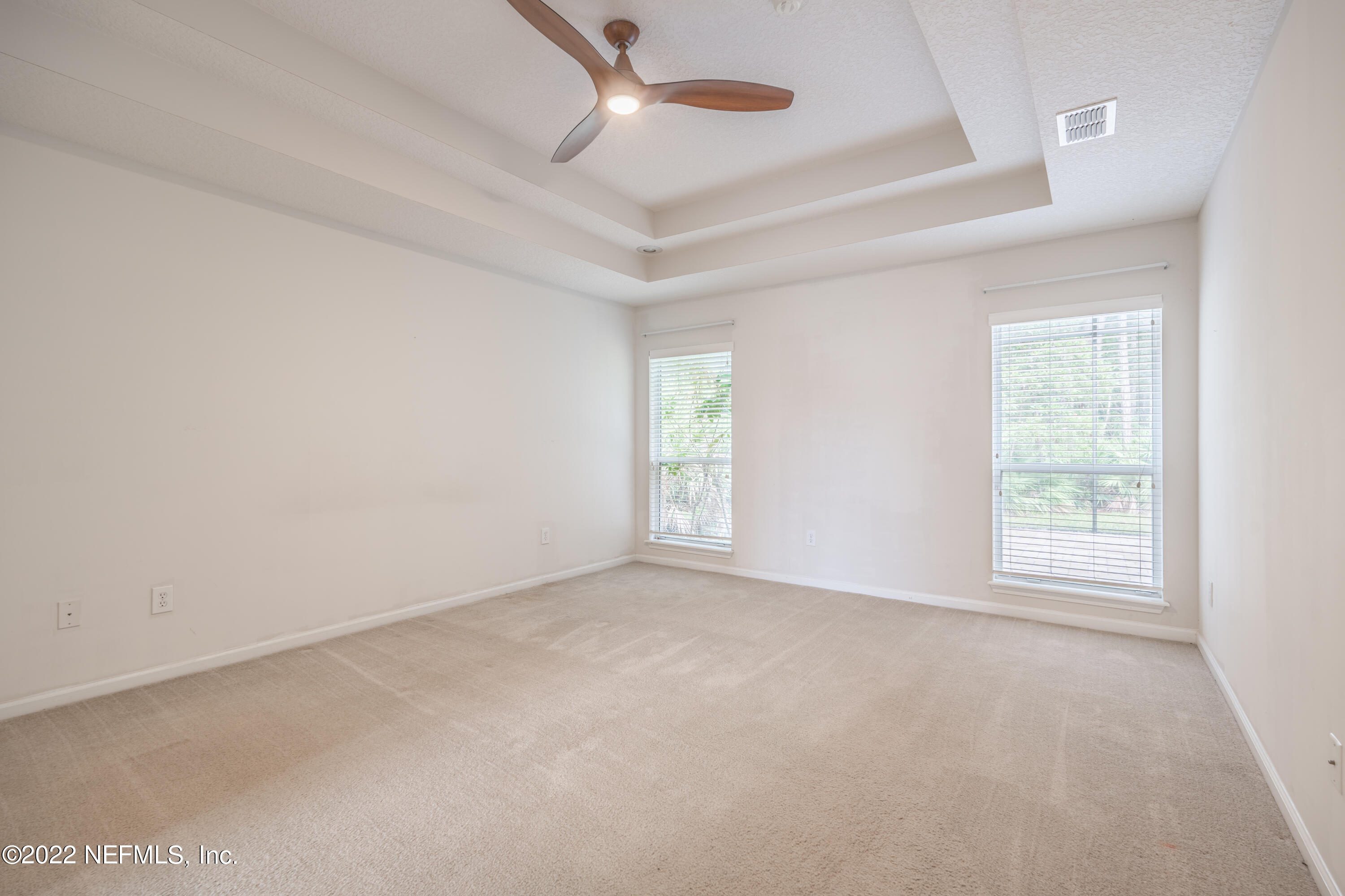 1535 Summerdown Way St. Johns, FL 32259 - Photo 9 of 38 an empty room with windows and ceiling fan