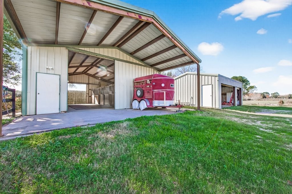 6610 Sprigg Street Fulshear, TX 77441 - Photo 42 of 49 a view of a backyard with garden