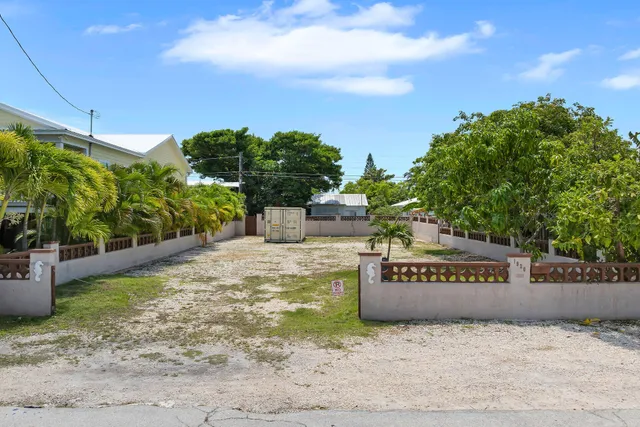a view of a park with plants and a bench