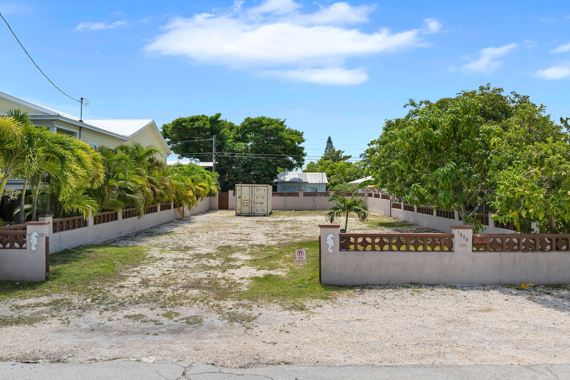 a view of a park with plants and a bench