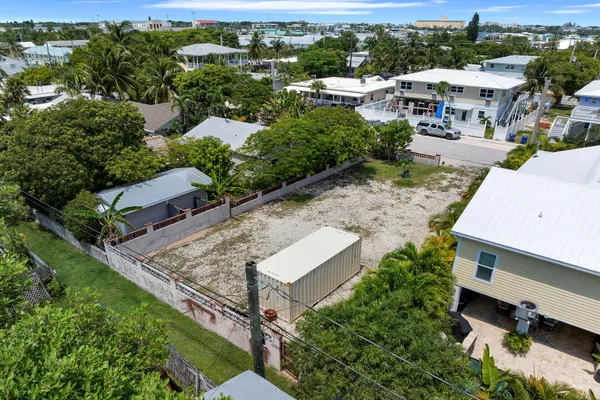 a front view of a house with a yard and a garage