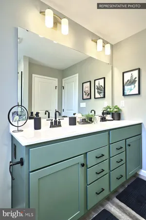 a bathroom with a double vanity sink and a mirror