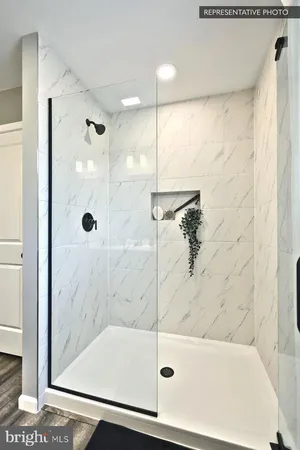 a bathroom with a bathtub and a shower