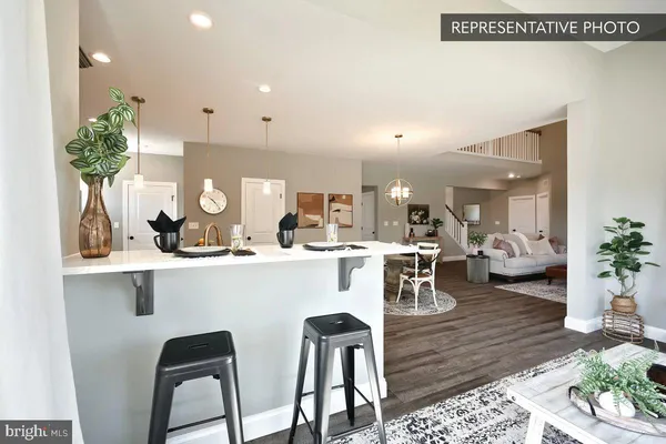 a kitchen with a table and chairs in it