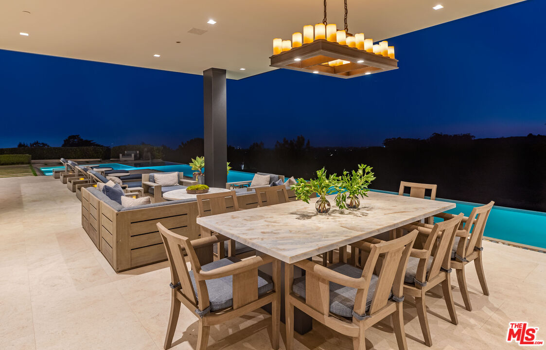 1601 Casale Road Pacific Palisades, CA 90272 - Photo 11 of 24 a view of a dining table and chairs in the patio