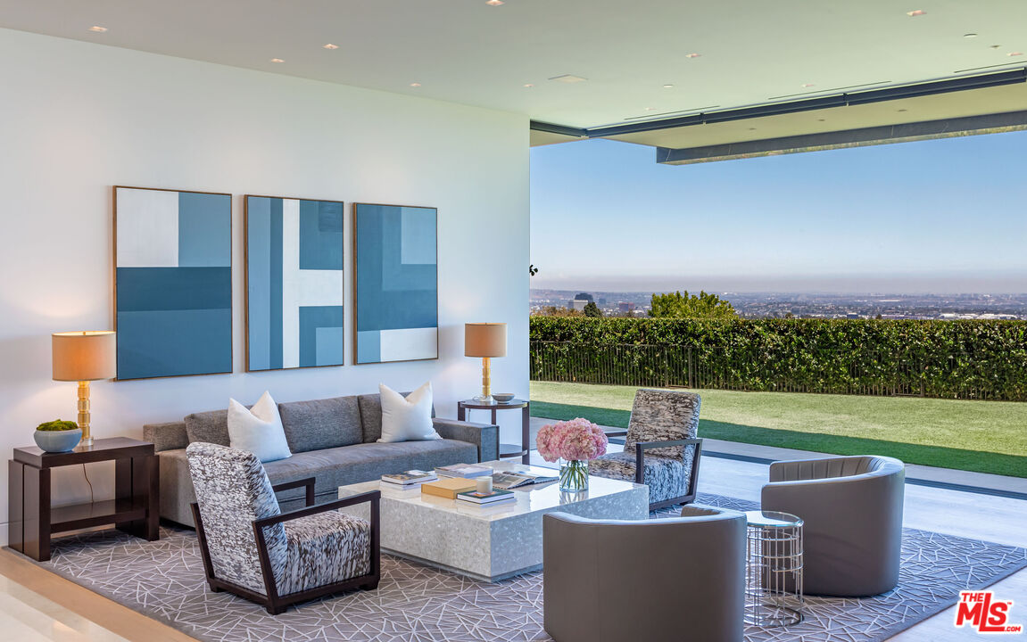 1601 Casale Road Pacific Palisades, CA 90272 - Photo 15 of 24 a living room with patio furniture and a garden