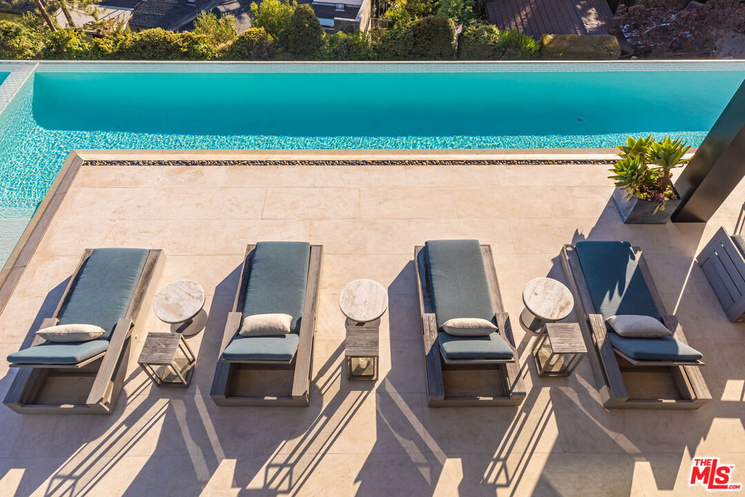 1601 Casale Road Pacific Palisades, CA 90272 - Photo 21 of 24 a view of a chairs and table in patio