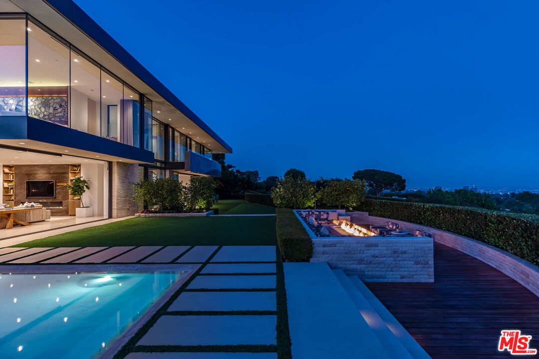 1601 Casale Road Pacific Palisades, CA 90272 - Photo 4 of 24 a view of a house with a yard