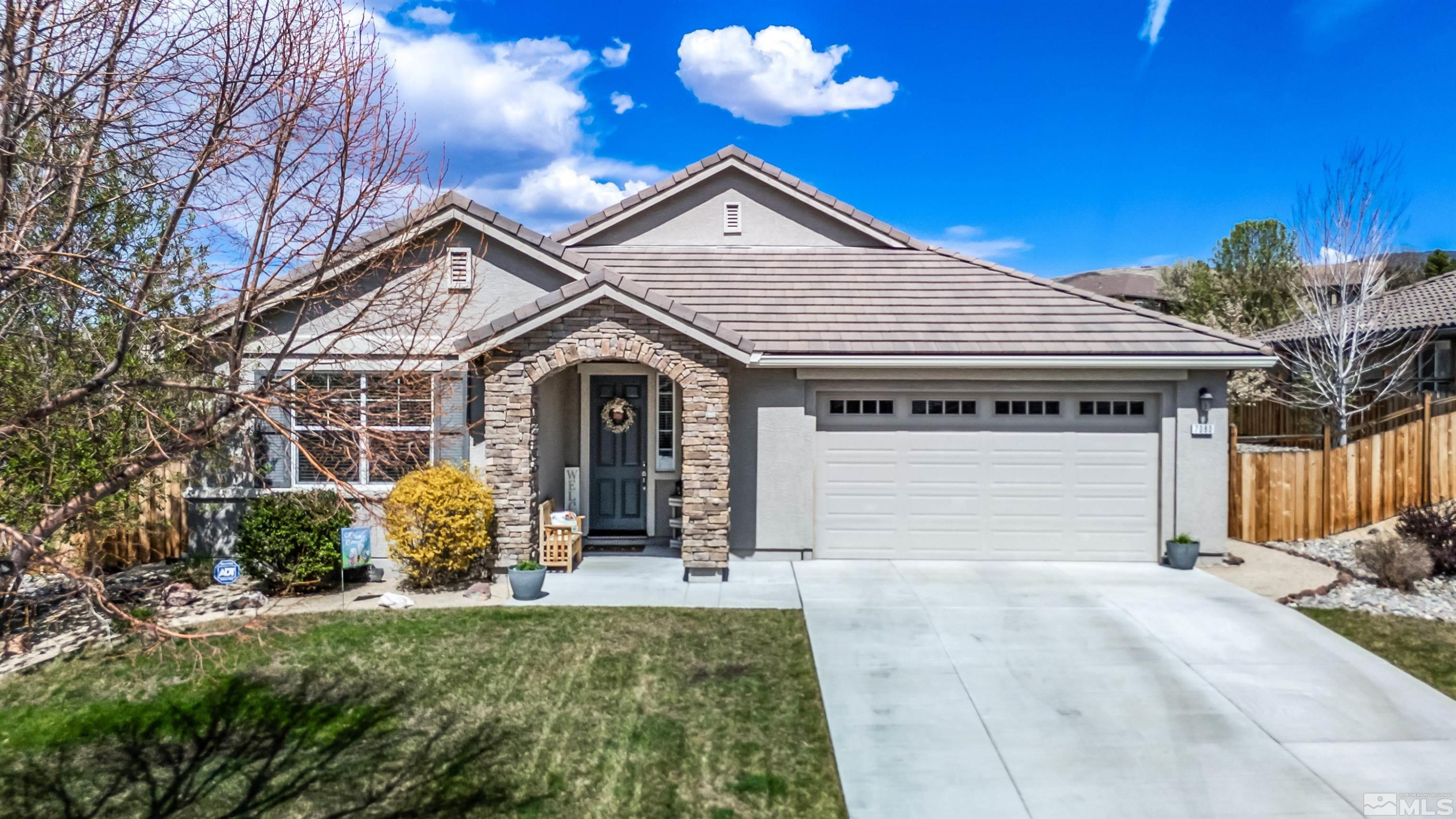 front view of a house with a yard