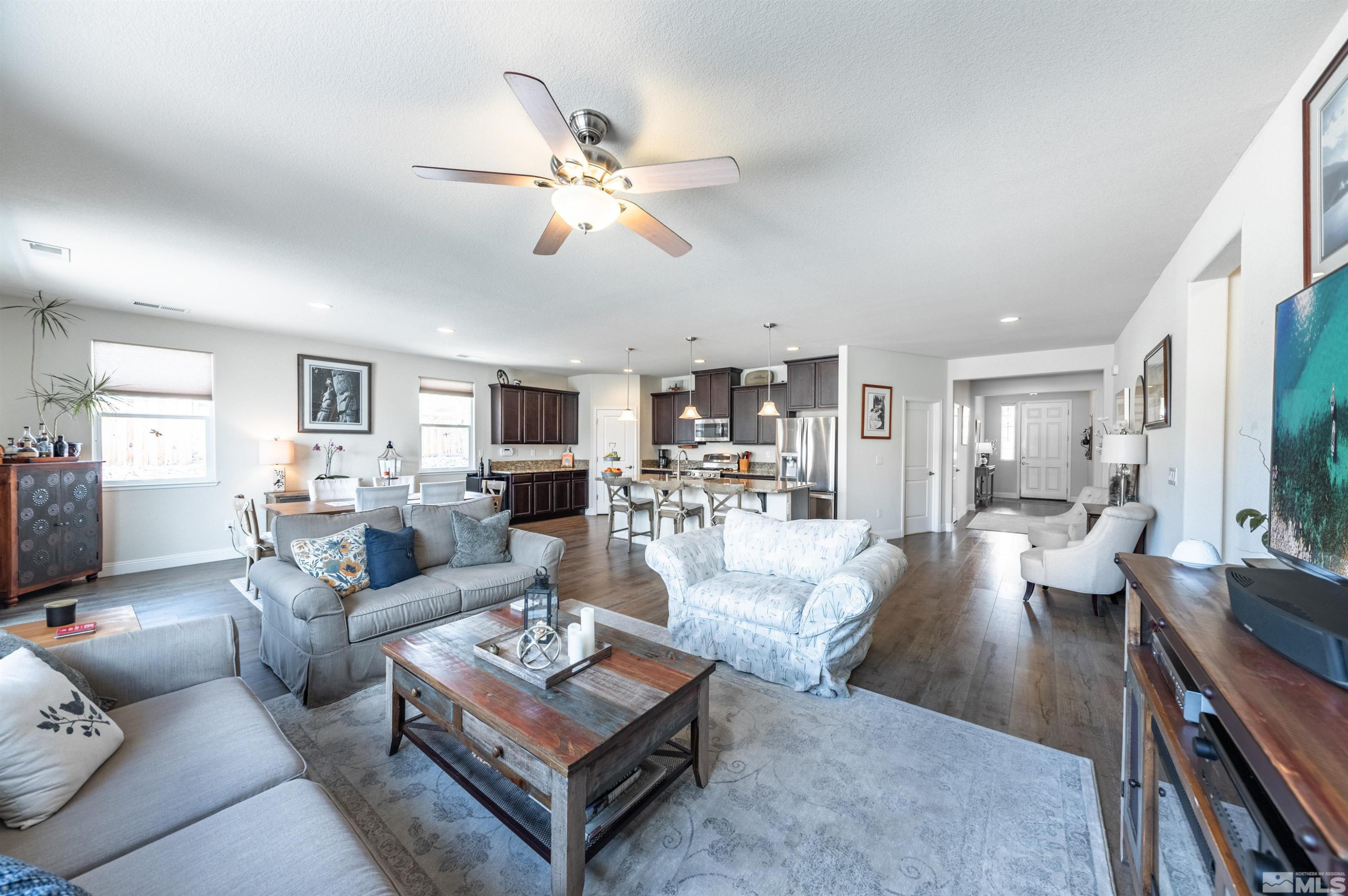 7080 Truth Drive Sparks, NV 89436 - Photo 15 of 40 a living room with furniture and a view of kitchen