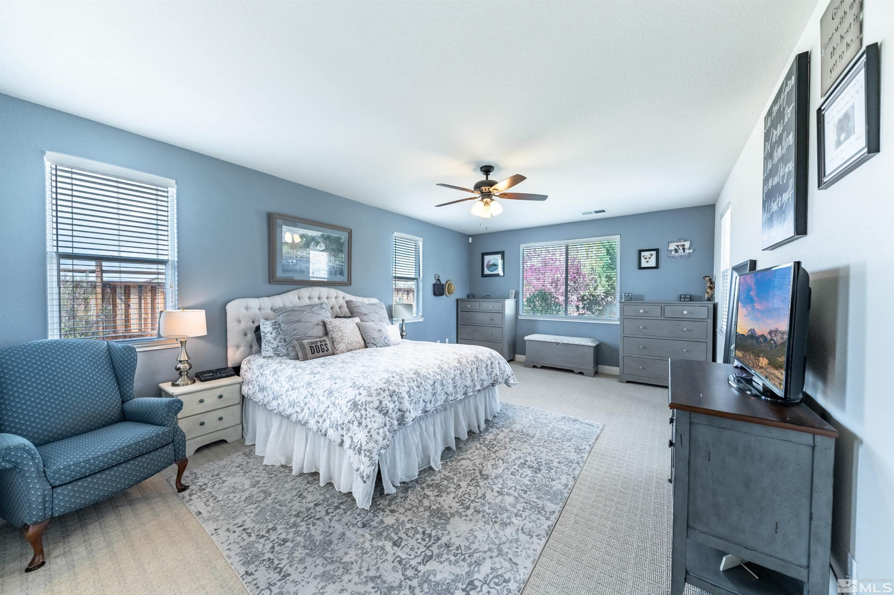 7080 Truth Drive Sparks, NV 89436 - Photo 16 of 40 a living room with furniture and a flat screen tv