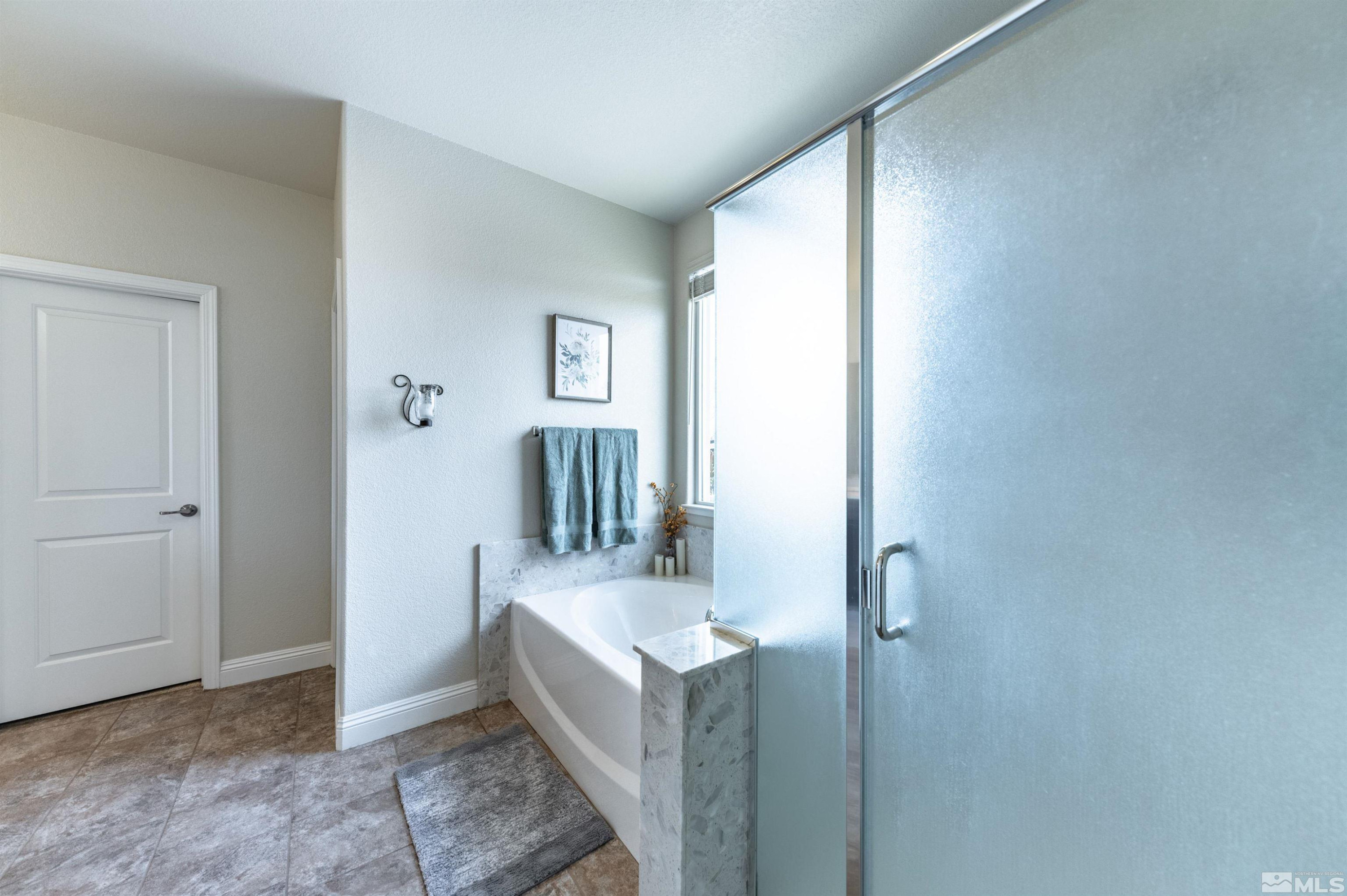 7080 Truth Drive Sparks, NV 89436 - Photo 18 of 40 a bathroom with a sink and mirror