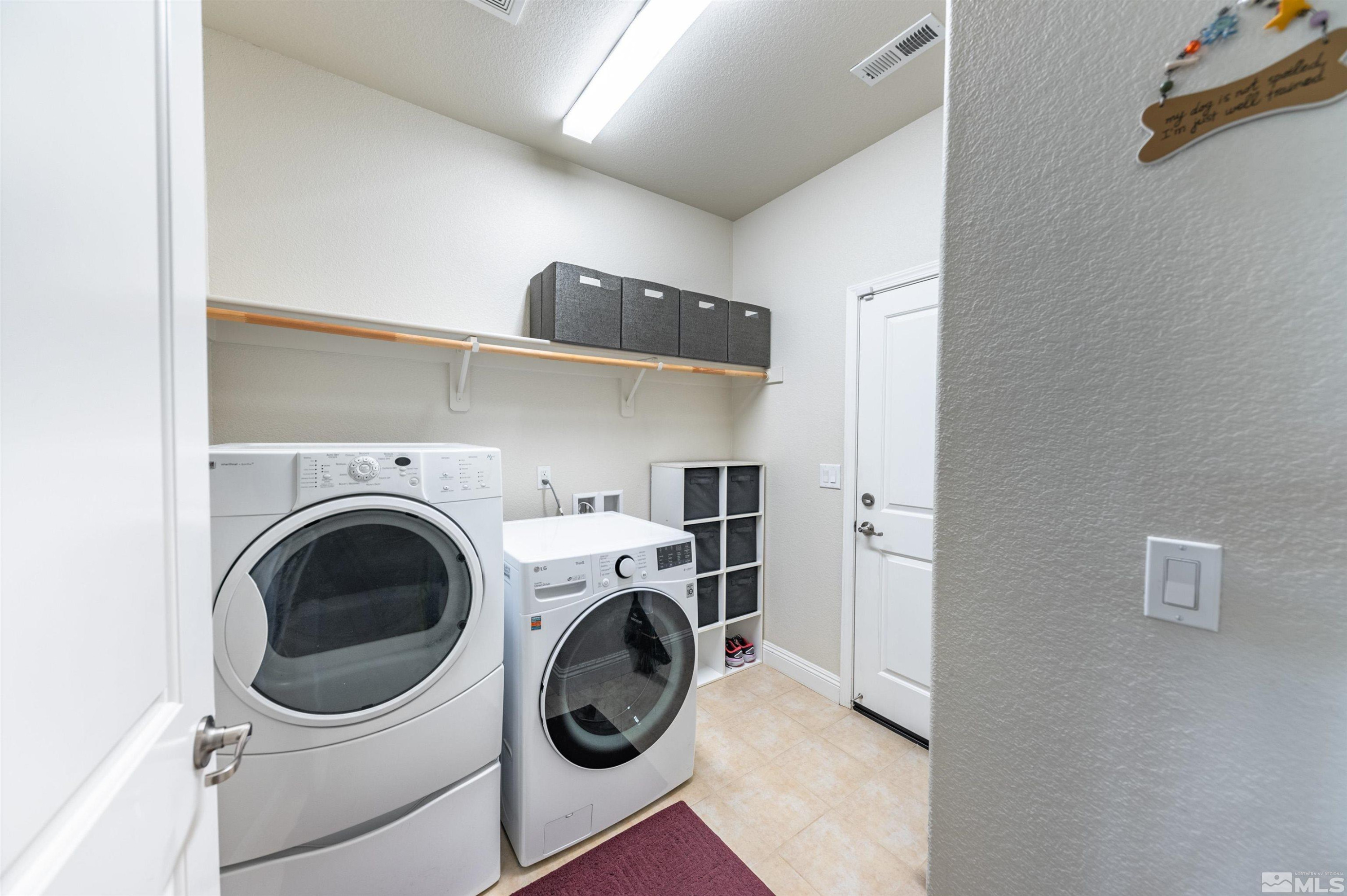 7080 Truth Drive Sparks, NV 89436 - Photo 25 of 40 a utility room with dryer and washer