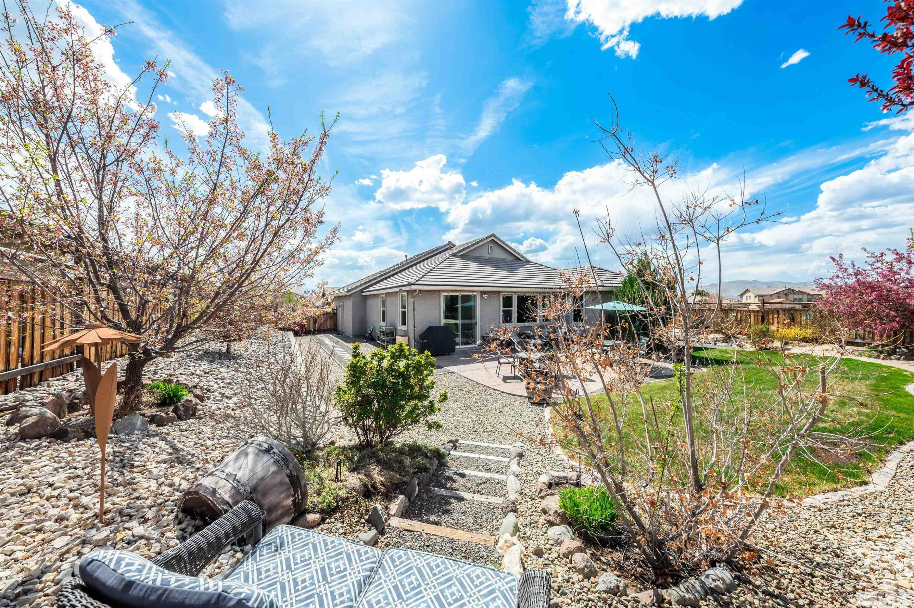 7080 Truth Drive Sparks, NV 89436 - Photo 30 of 40 a front view of a house with a yard