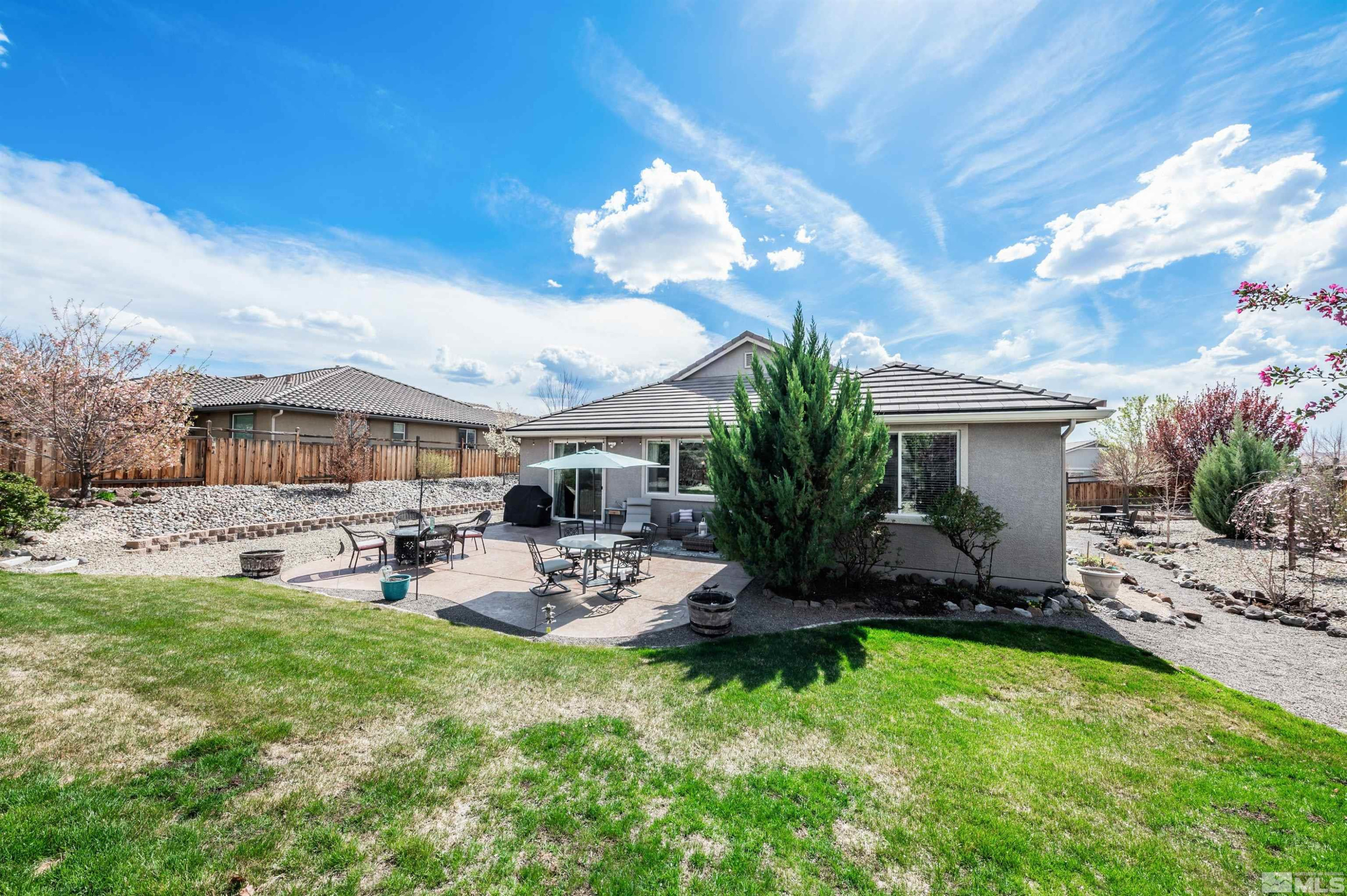 7080 Truth Drive Sparks, NV 89436 - Photo 32 of 40 a view of a house with backyard and sitting area