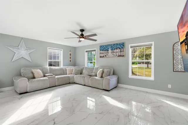 a kitchen with a sink stainless steel appliances and white cabinets