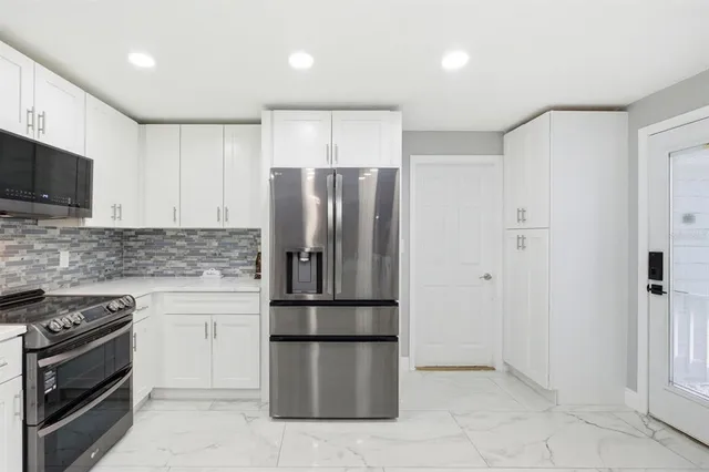 a bed room with a bed and a mirror