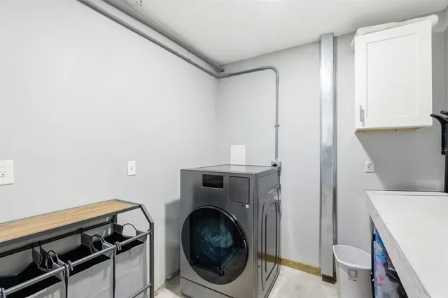 a bathroom with a granite countertop sink a toilet and a mirror