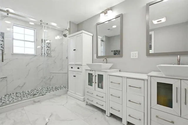a view of a livingroom with a ceiling fan and window