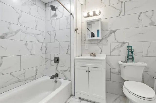 a view of a chairs and table in the patio