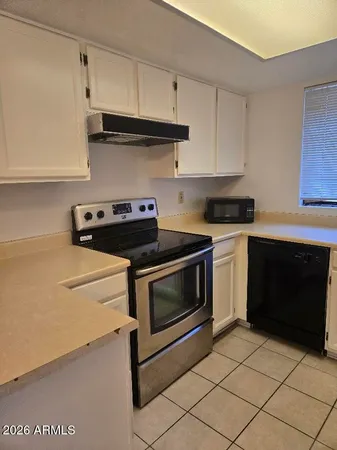 a white refrigerator freezer sitting inside of a kitchen