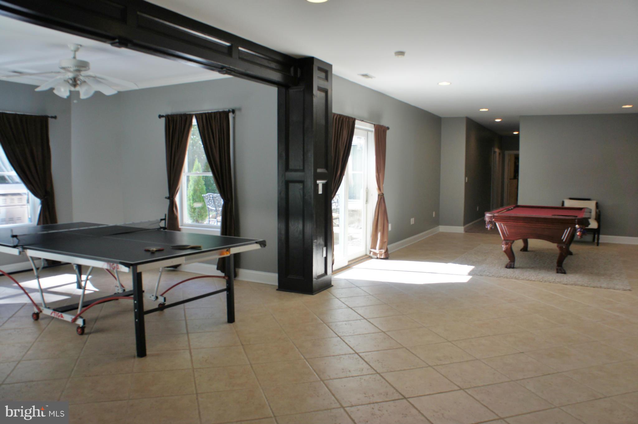 13292 Olivet Road Lusby, MD 20657 - Photo 22 of 30 LL Recreation room - SGD to Pool area!