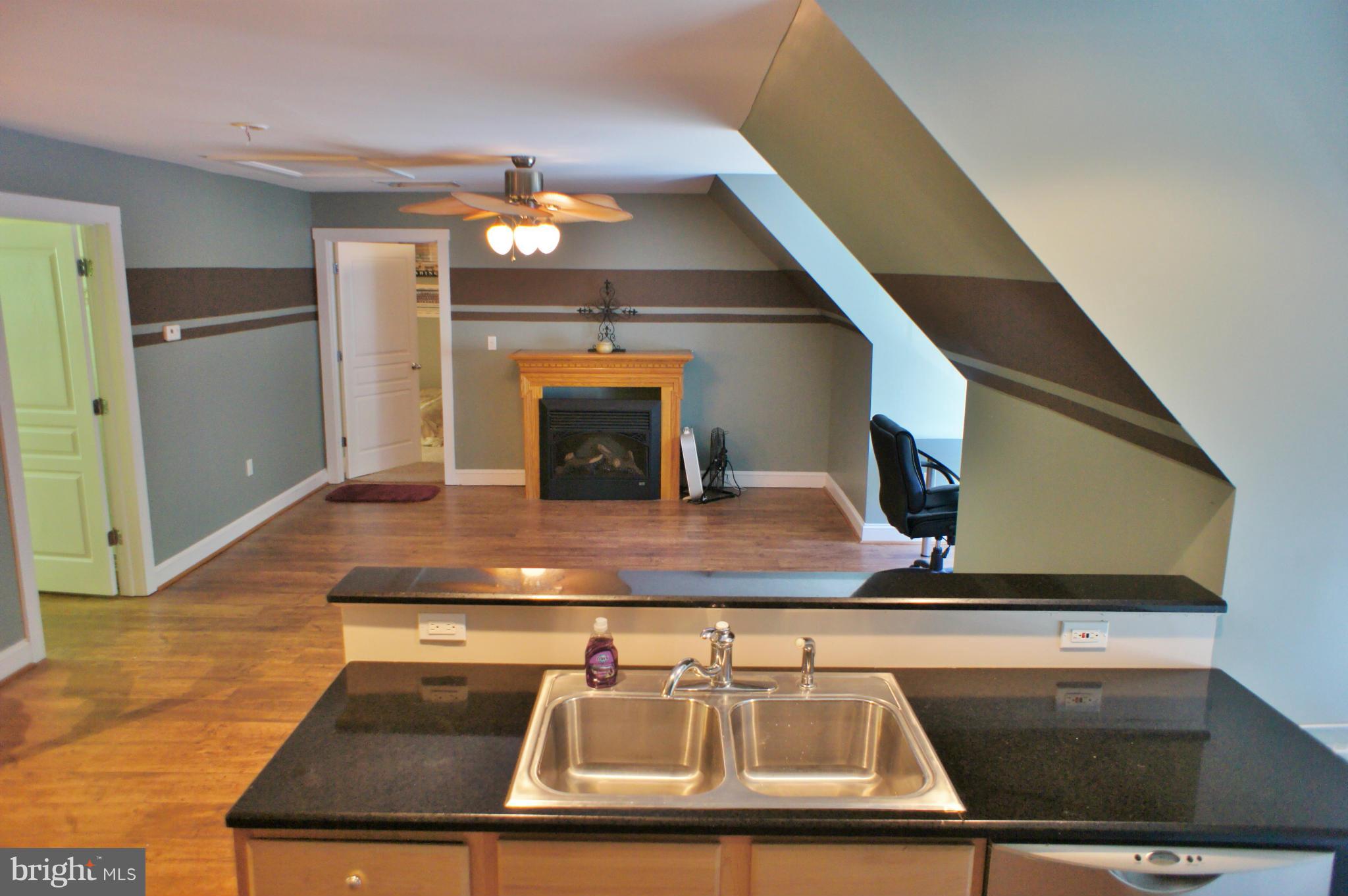13292 Olivet Road Lusby, MD 20657 - Photo 28 of 30 In-Law Apt has full kitchen, FP, B/R w/WI closet!