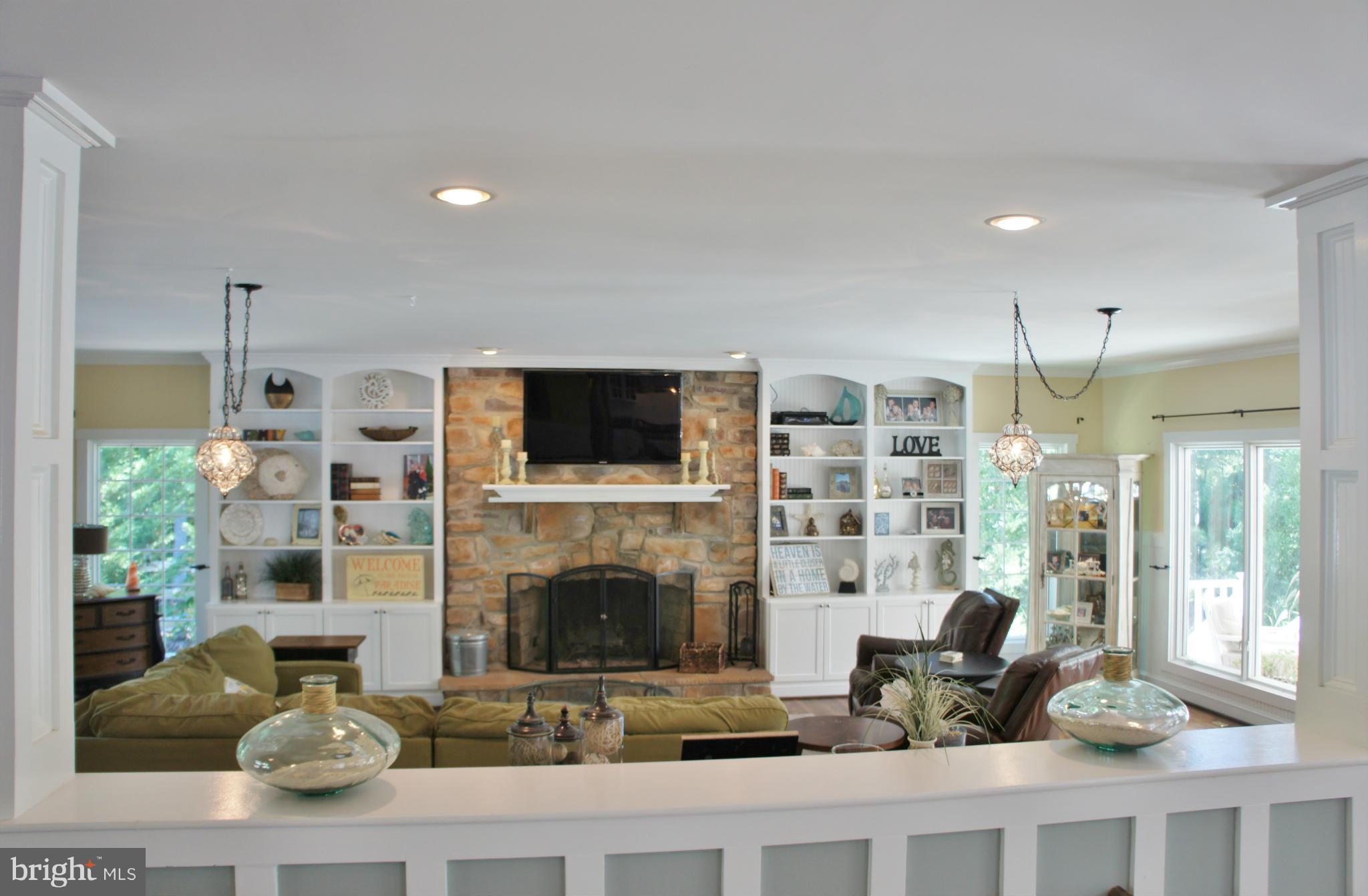 13292 Olivet Road Lusby, MD 20657 - Photo 7 of 30 Stone fireplace flanked by built-in bookcases!