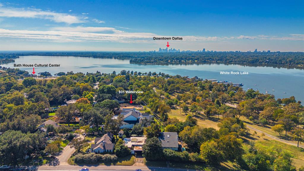 9431 Waterview Road Dallas, TX 75218 - Photo 1 of 19 Bird's eye view of a large body of water and city skyline
