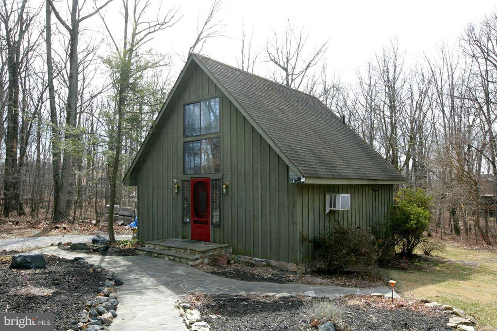 13217 Highland Road Highland, MD 20777 - Photo 3 of 23 a front view of a house with garden