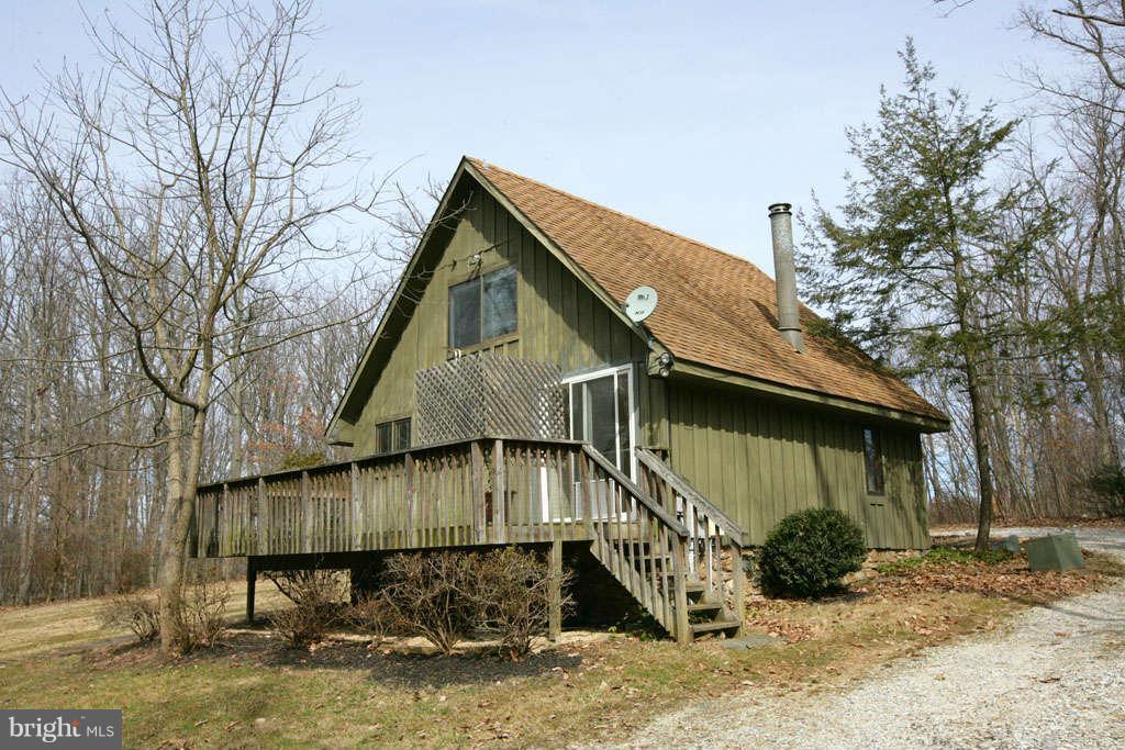 13217 Highland Road Highland, MD 20777 - Photo 22 of 23 a view of a small house with a yard